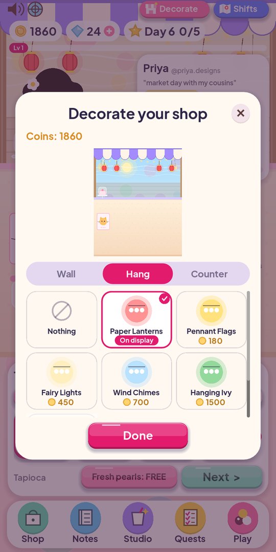 Decorating the bubble tea cart with lanterns and a neon sign